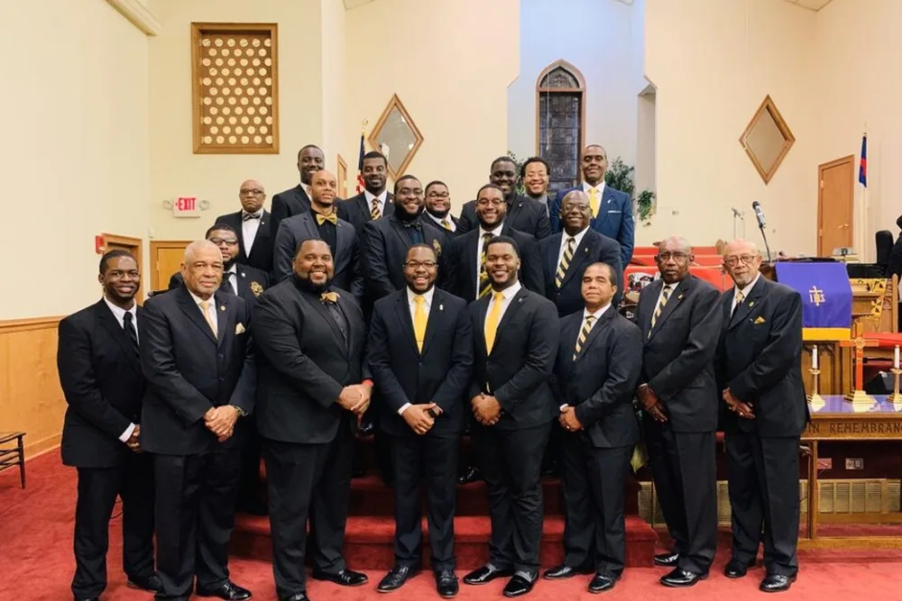 The chapter assembled at the front of a church sanctuary.